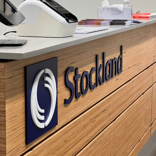 stockland reception sign signage at stockland